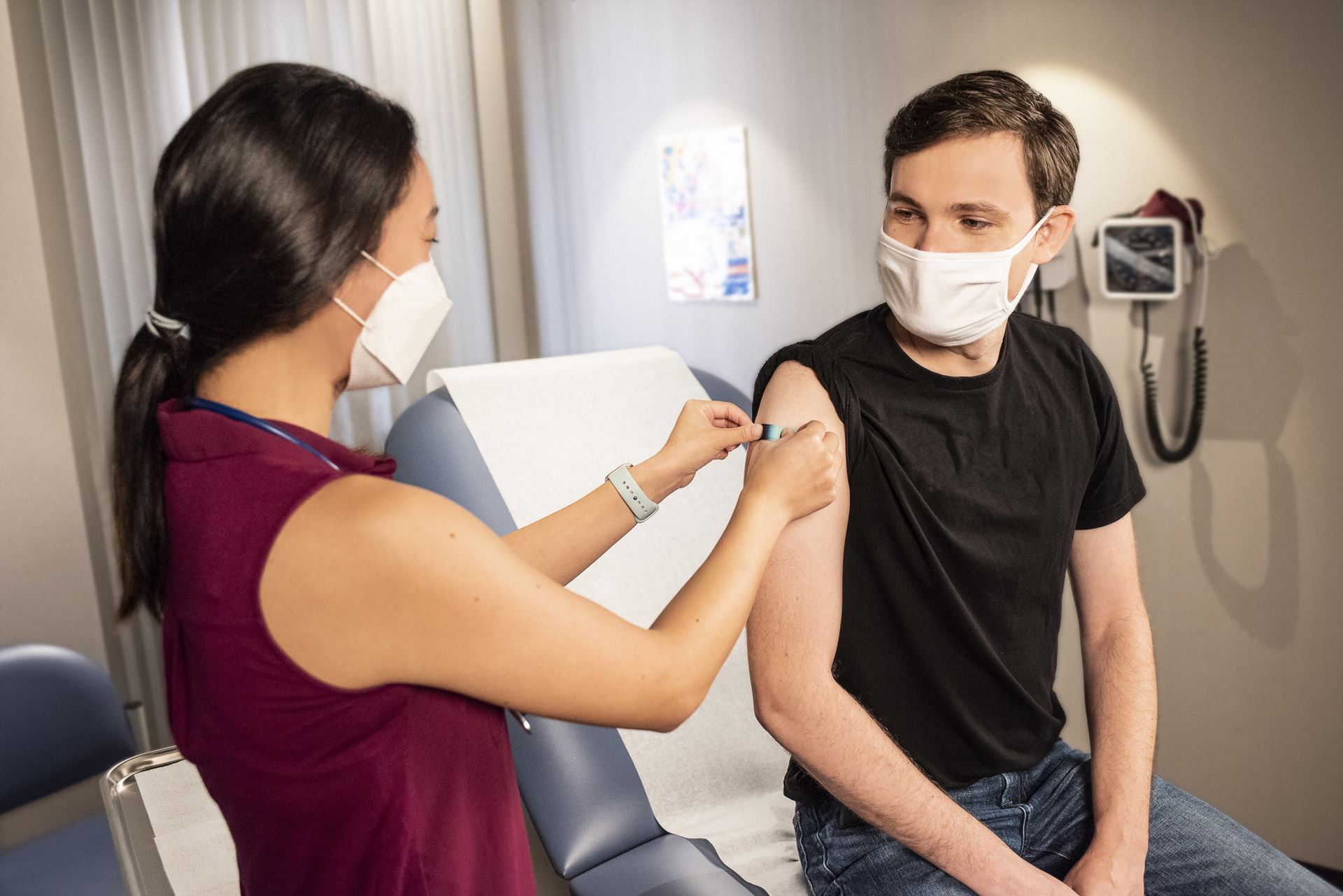 a clinician administering a vaccines