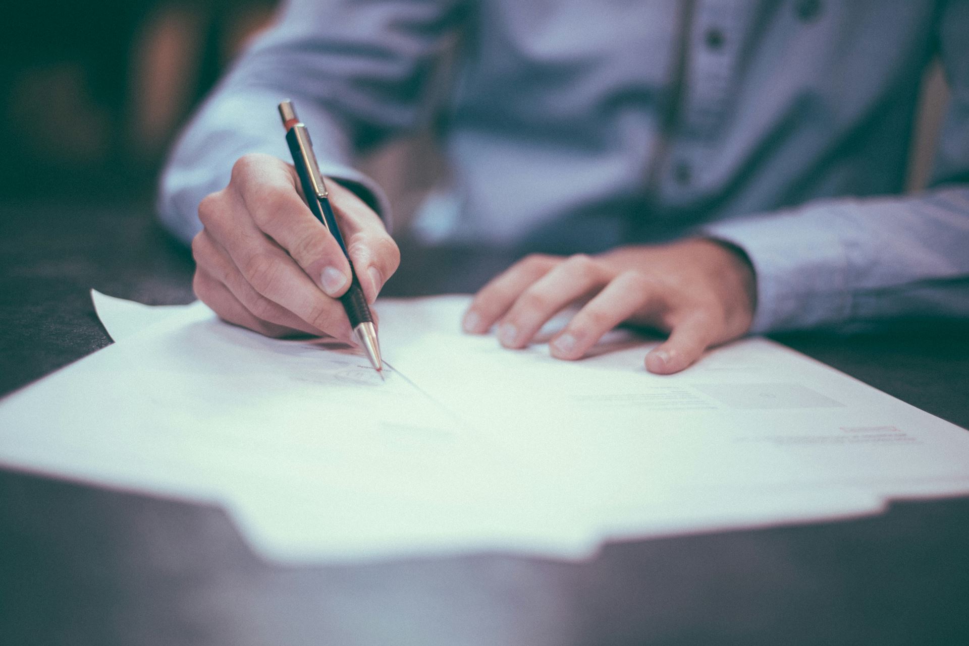 a man filling out a form